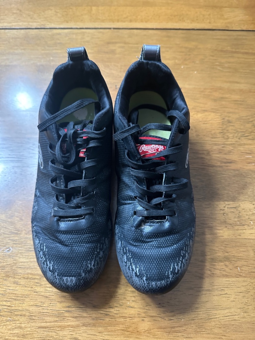 Rawlings Black Athletic Shoes with Red Tongue Logo